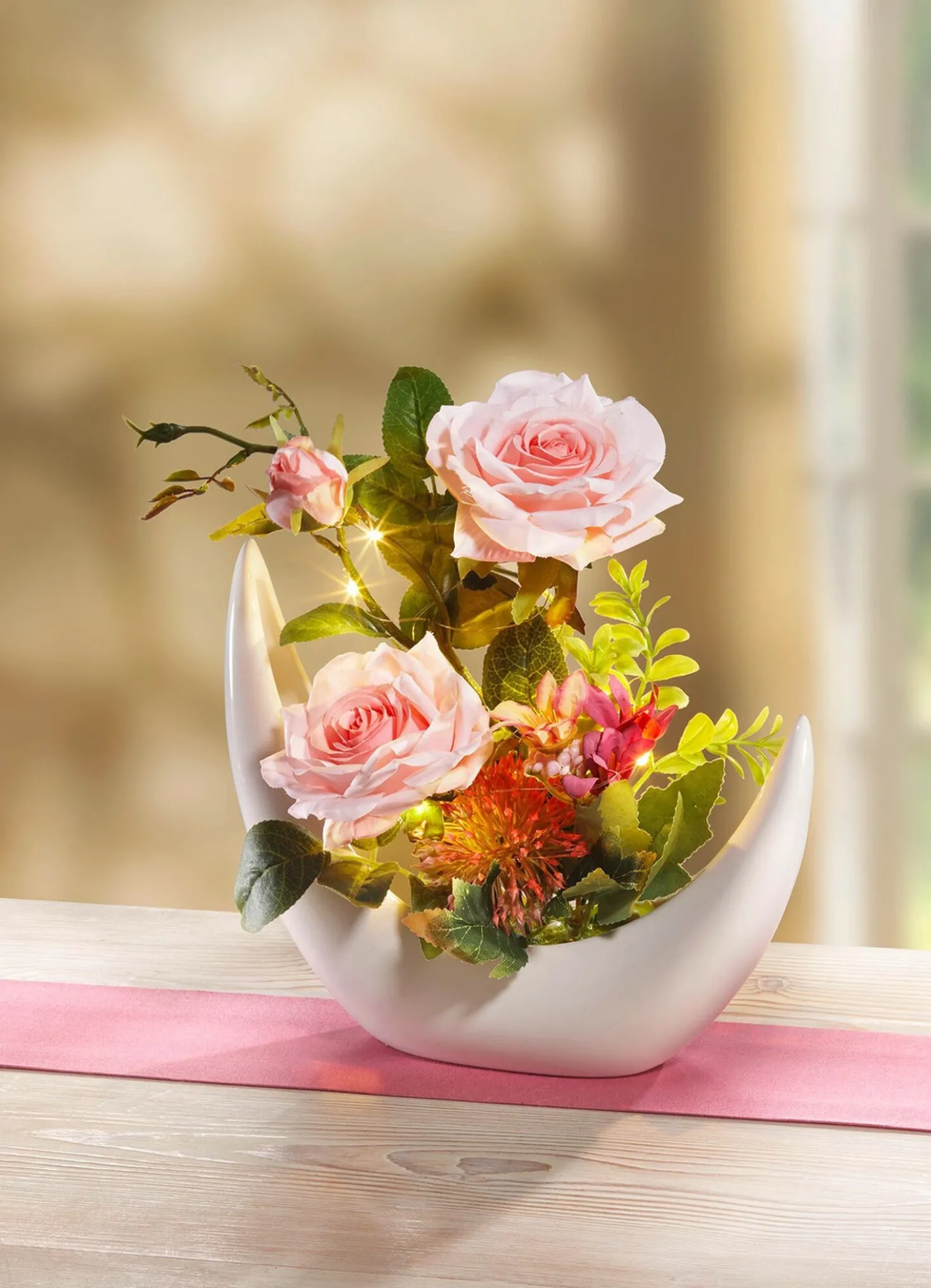 Beleuchtetes Rosen-Arrangement